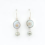 Pair of earrings with shell and pearl designs on a white background