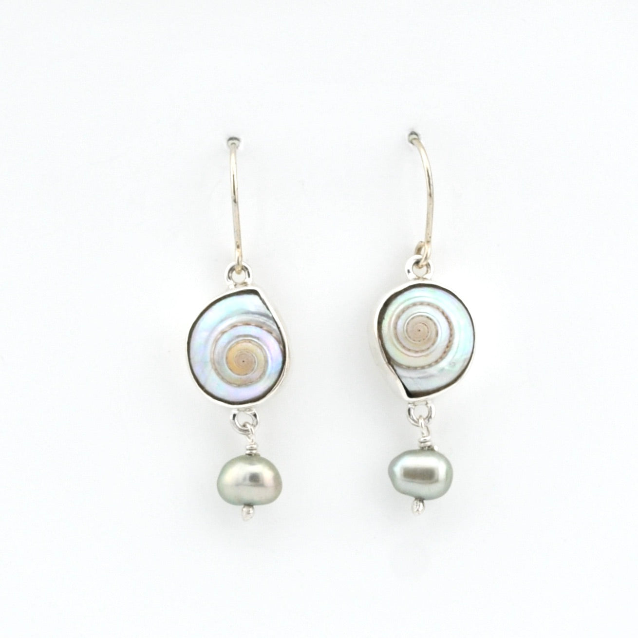 Pair of earrings with shell and pearl designs on a white background