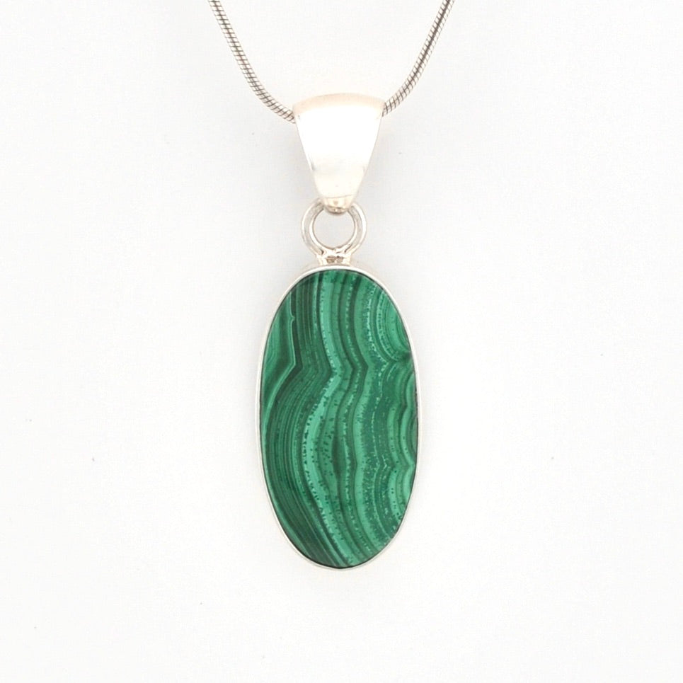 Green malachite pendant on a white background