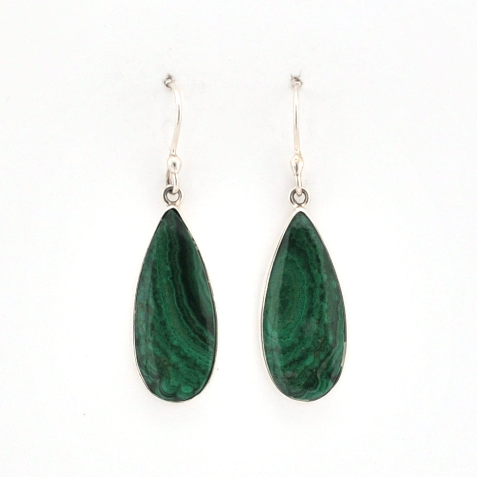 Teardrop-shaped green earrings on a white background
