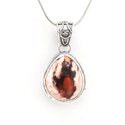 Copper pendant necklace on a white background