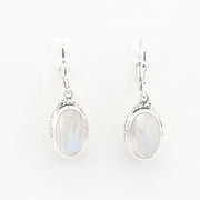 Pair of silver earrings with moonstone stones on a white background