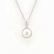 Pearl necklace with silver chain on a white background