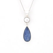 Blue teardrop necklace on a white background
