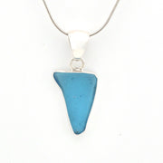 Blue pendant necklace on a white background