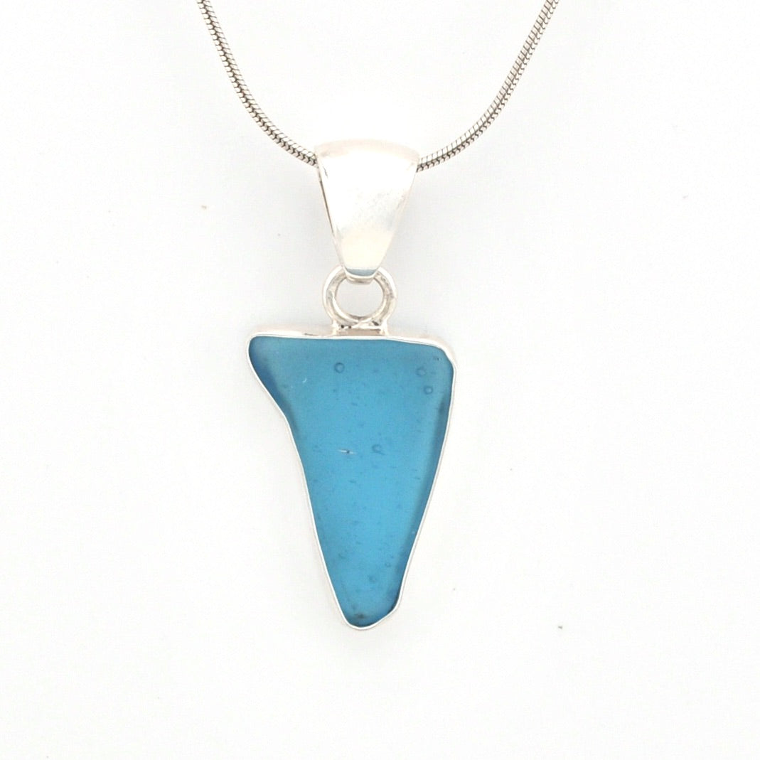 Blue pendant necklace on a white background
