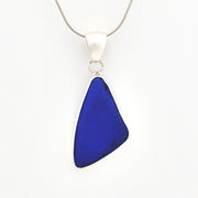 Blue pendant necklace on a white background