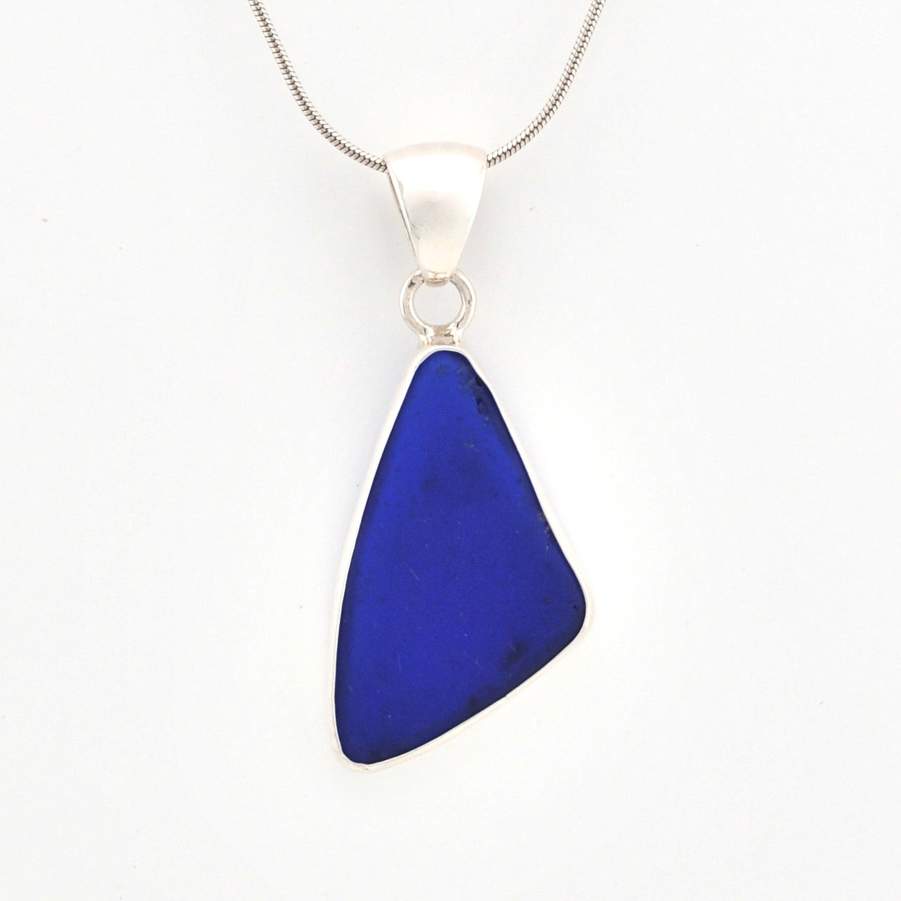 Blue pendant necklace on a white background