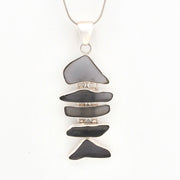 Necklace with a pendant made of stacked violet glass on a white background
