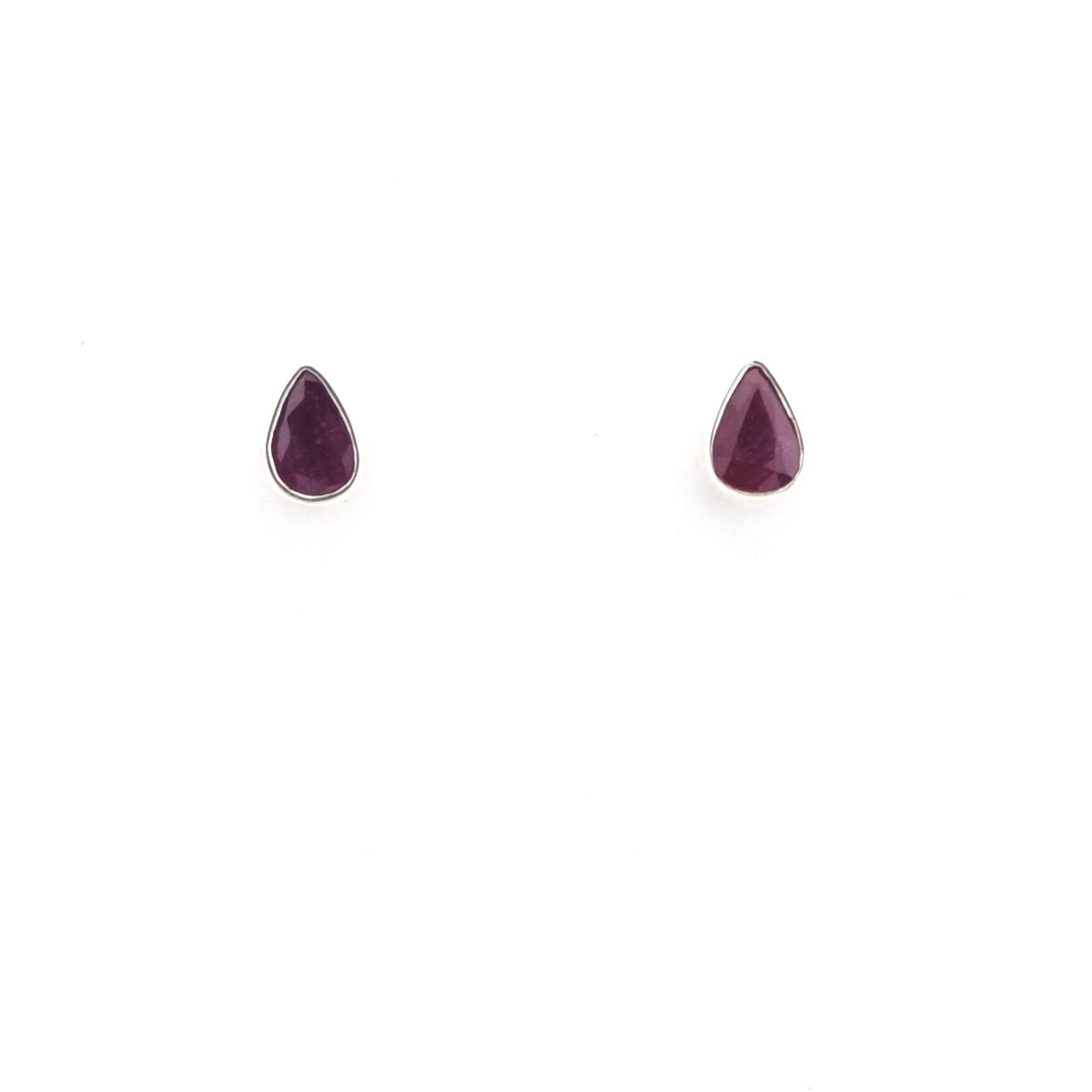 Pair of teardrop-shaped purple gemstone earrings on a white background