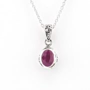 Silver Ruby 5x7mm Oval Bali Necklace on white background