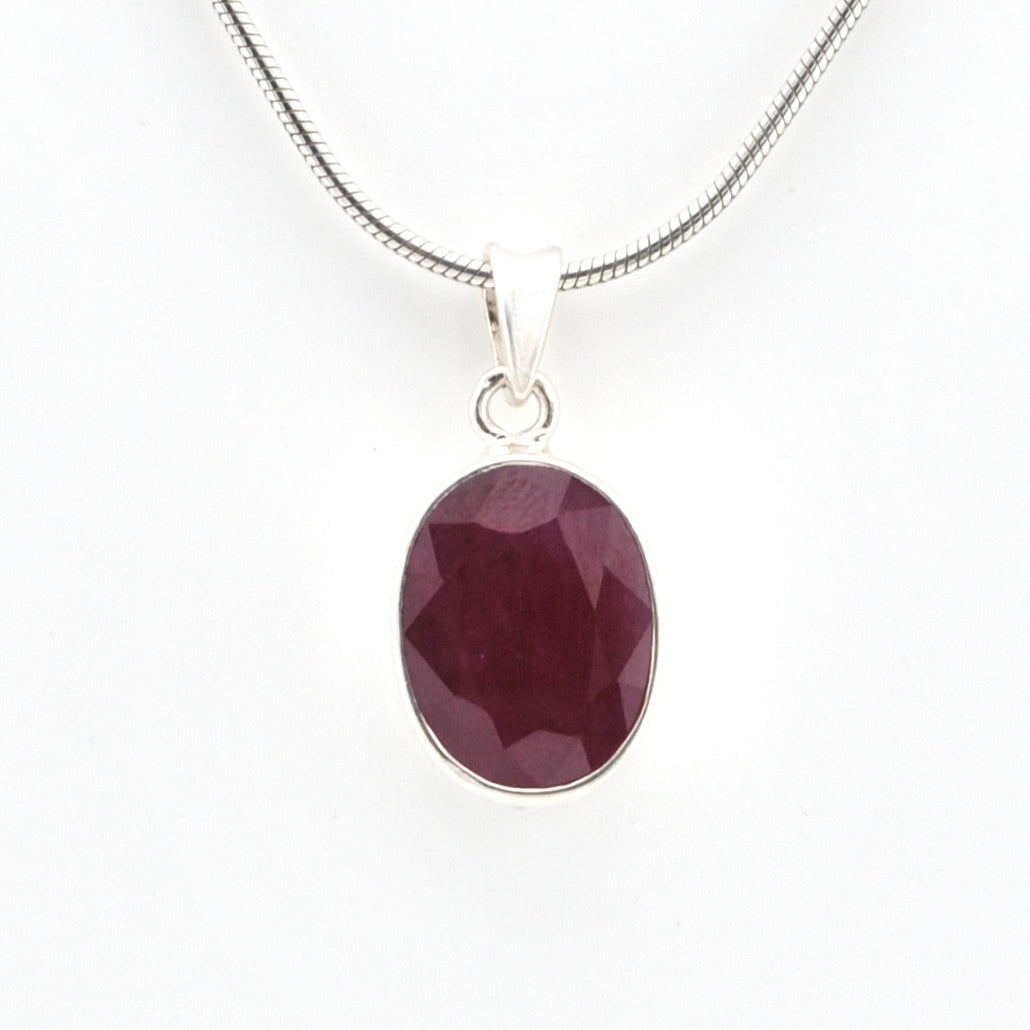 Necklace with a purple pendant on a white background
