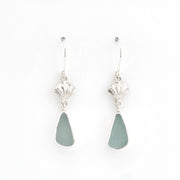 Pair of silver earrings with green teardrop-shaped stones on a white background