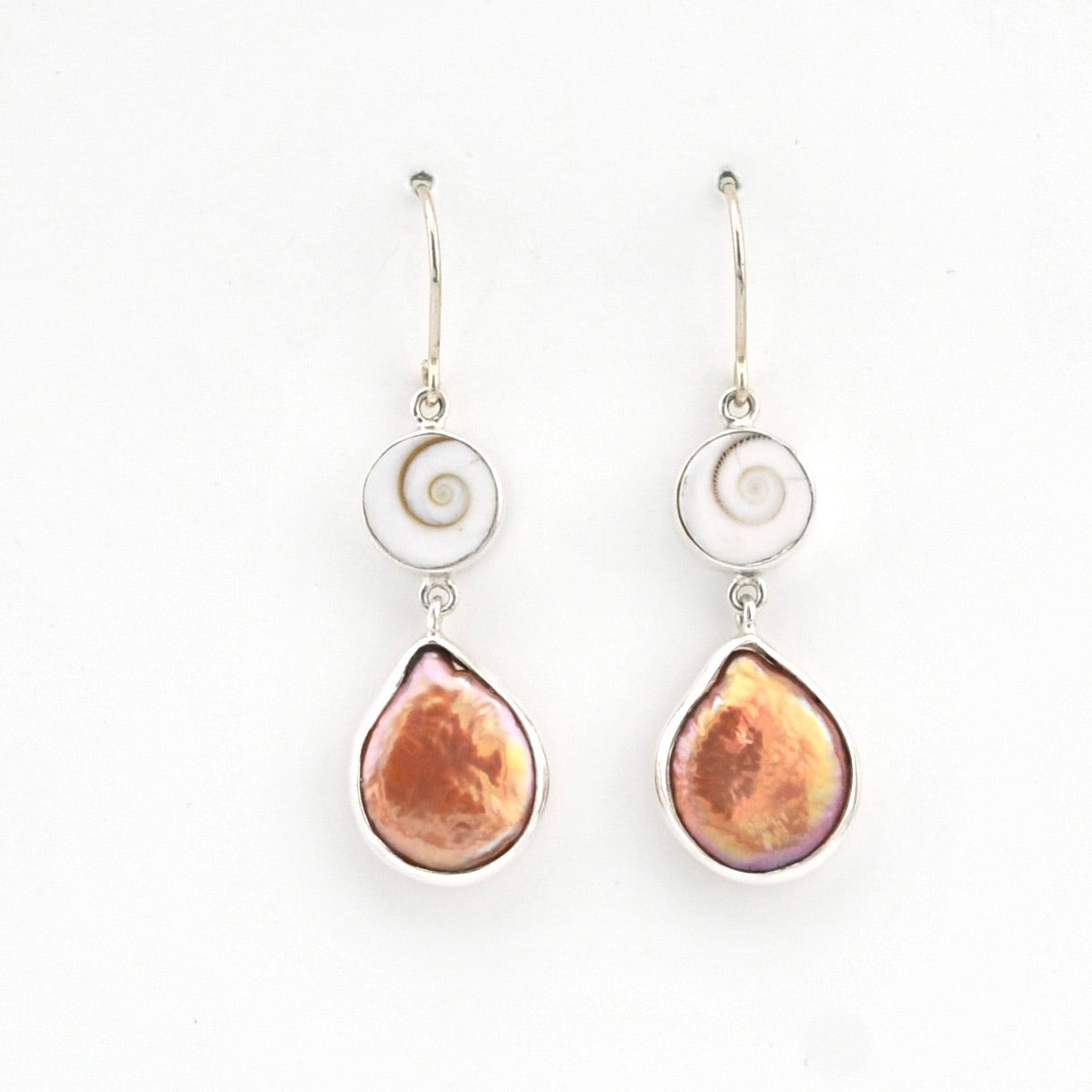 Pair of earrings with teardrop-shaped brown stones on a white background