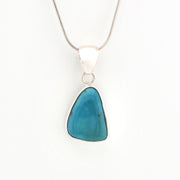 Necklace with a blue pendant on a white background