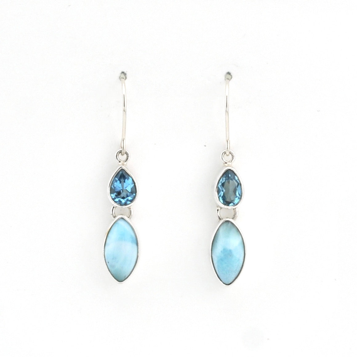 Pair of earrings with blue gemstones on a white background