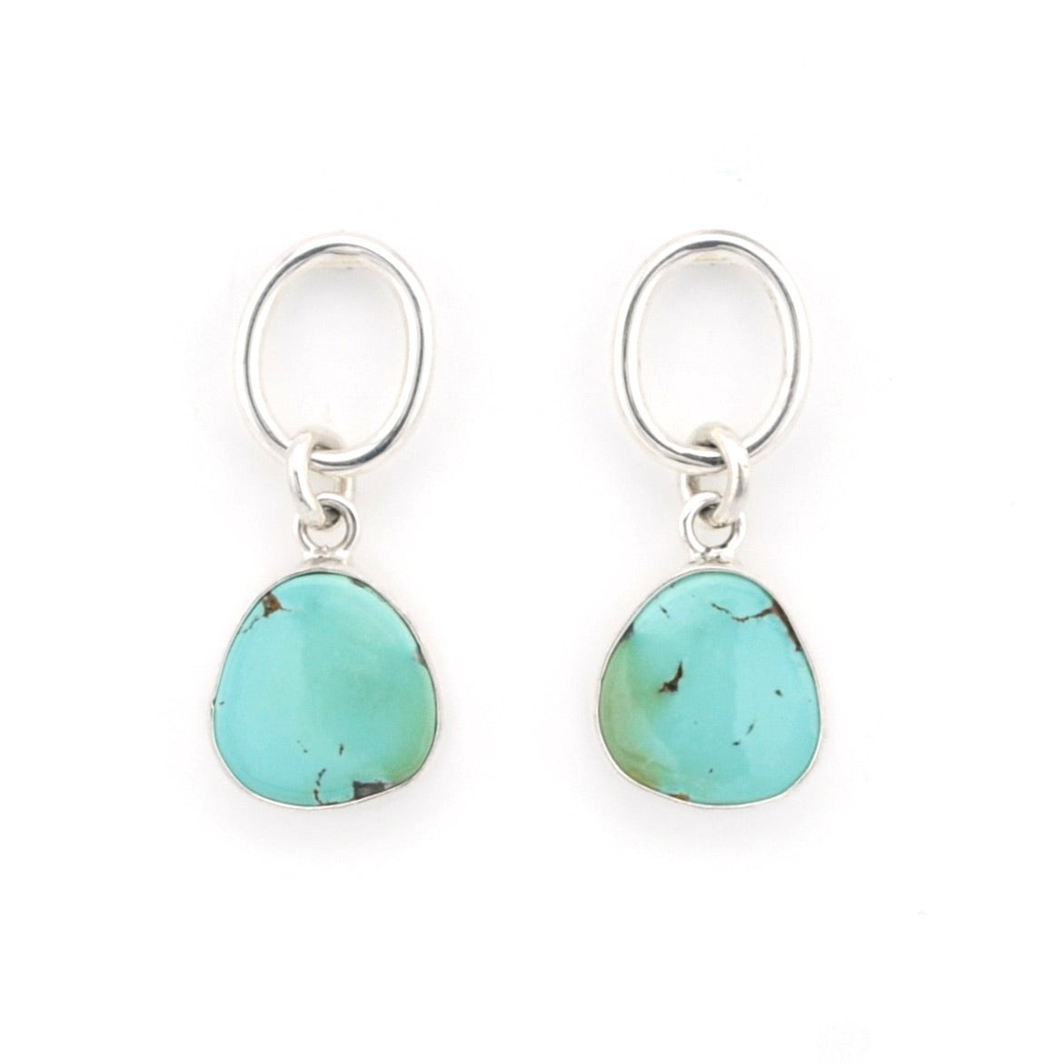Turquoise earrings with silver hooks on a white background