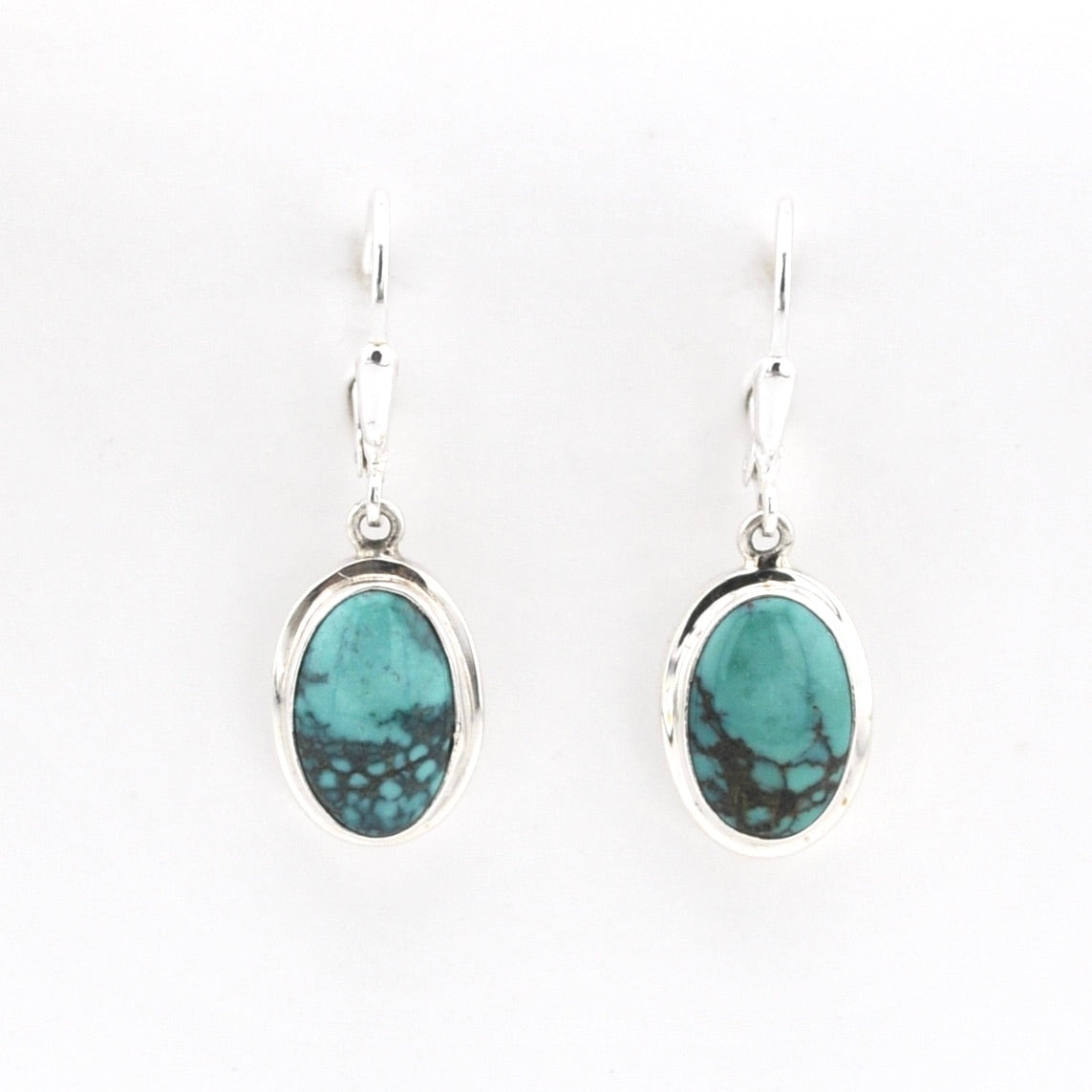 Silver Turquoise Oval Dangle Earrings on white background