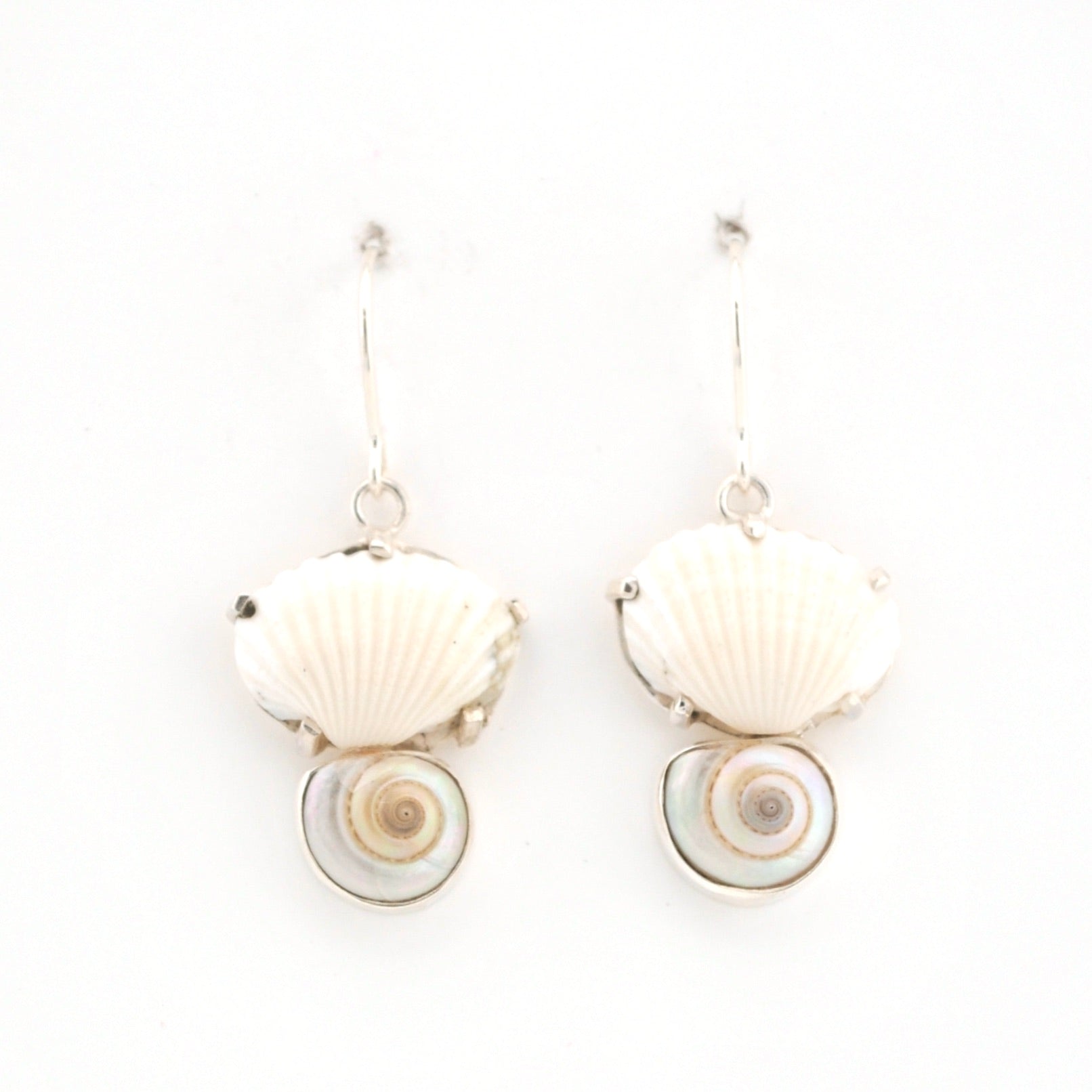 Shell-shaped earrings on a white background