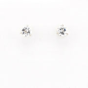 Pair of white topaz stud earrings on a white background