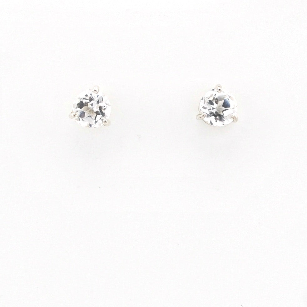 Pair of white topaz stud earrings on a white background