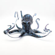 Glass octopus sculpture on a white background