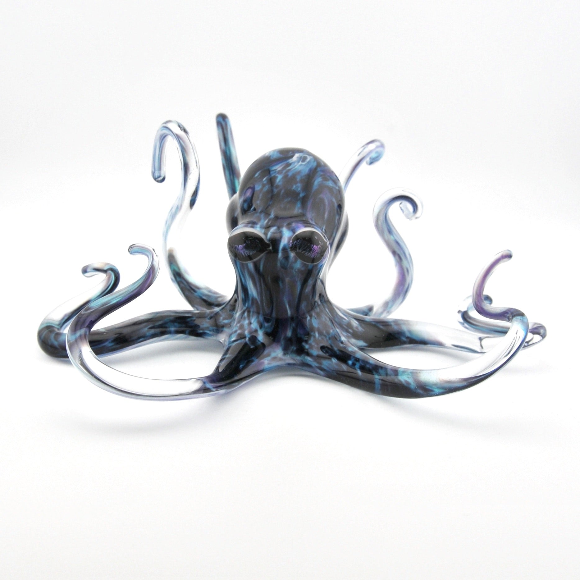 Glass octopus sculpture on a white background
