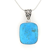 A square-shaped turquoise pendant necklace with a silver-toned bezel and chain, shown against a plain white background.