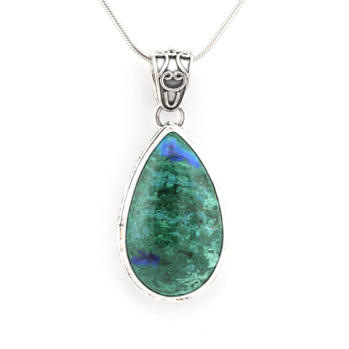 A teardrop-shaped pendant necklace featuring a green azurite gemstone with blue flashes, set in a silver bezel with a silver bail, suspended from a silver chain against a white background.