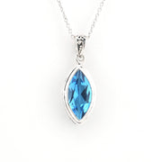 A silver pendant necklace featuring a marquise-cut blue gemstone in a silver bezel setting, suspended from a delicate silver chain against a plain white background.