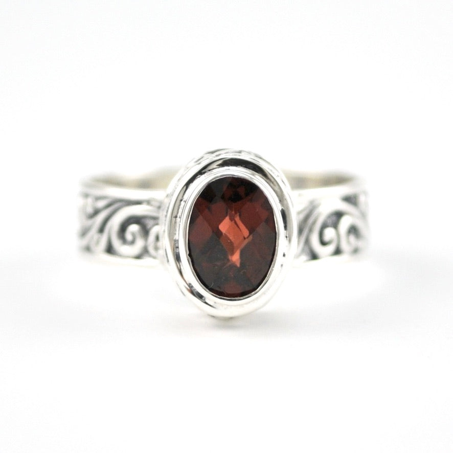 Front View Sterling Silver Garnet 5x7mm Oval Swirl Band Ring