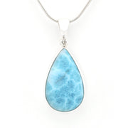A teardrop-shaped Larimar pendant necklace in a silver bezel setting on a silver snake chain, shown against a plain white background.