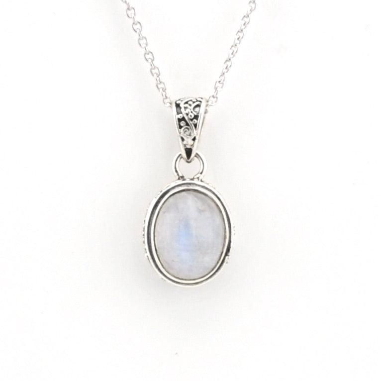 A silver pendant necklace featuring an oval-shaped light blue and white moonstone gemstone in a silver bezel setting, suspended from a delicate silver chain against a plain white background.