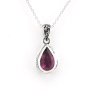 Pink tourmaline teardrop pendant on cahin on white background