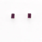 A pair of small rectangular stud earrings with dark purple rectangular gemstones in silver settings, shown on a plain white background.