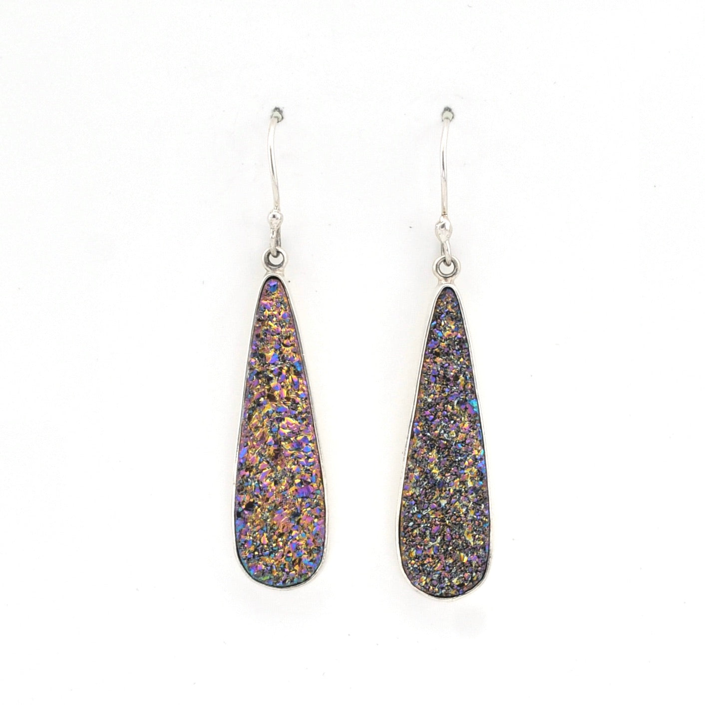 Teardrop-shaped earrings with multicolored speckles on a white background