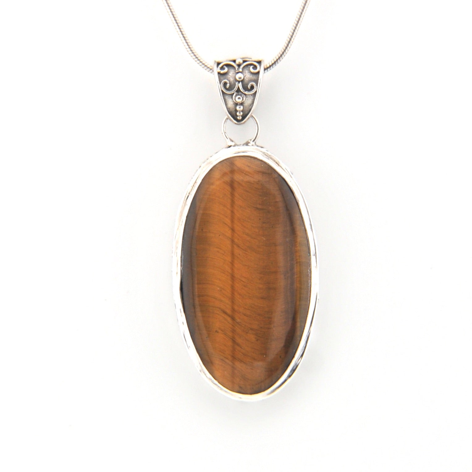 Tiger's eye pendant on a white background
