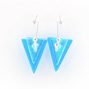 Pair of blue triangle earrings on a white background