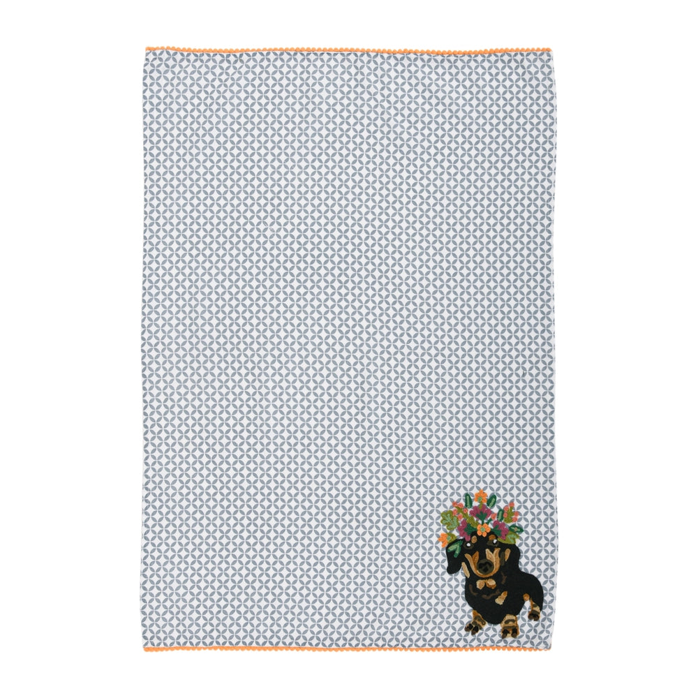 Fabric with a small dog design and geometric pattern on a white background