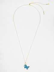 Gold necklace with a blue butterfly pendant on a white background