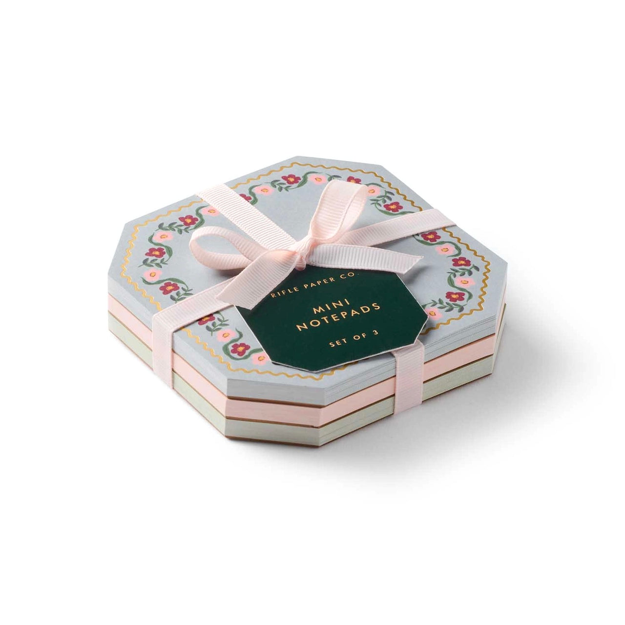 Hexagonal box of mini notepads with a ribbon on a white background