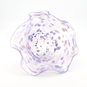 Decorative glass bowl with a textured surface on a white background