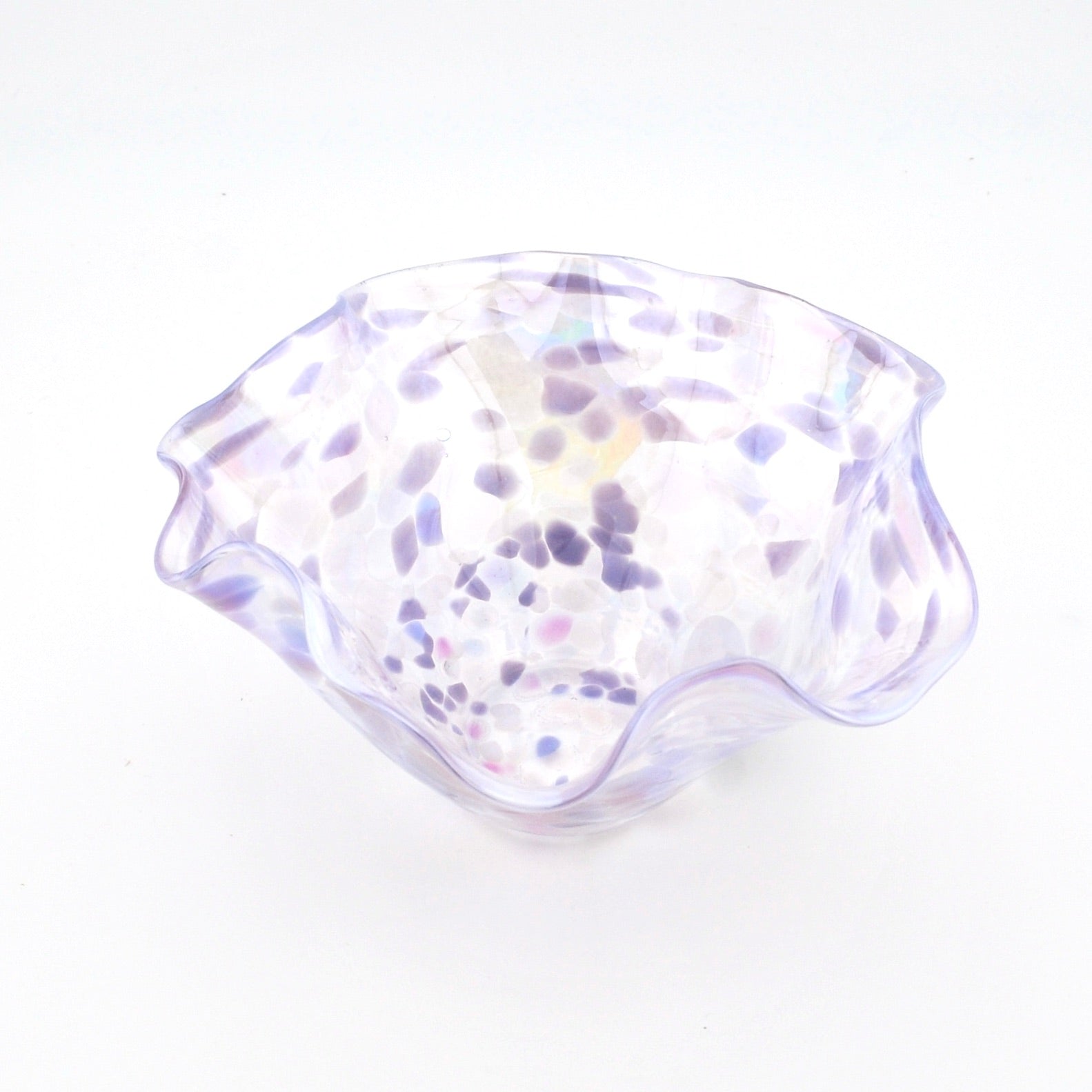 Clear glass bowl with purple speckles on a white background