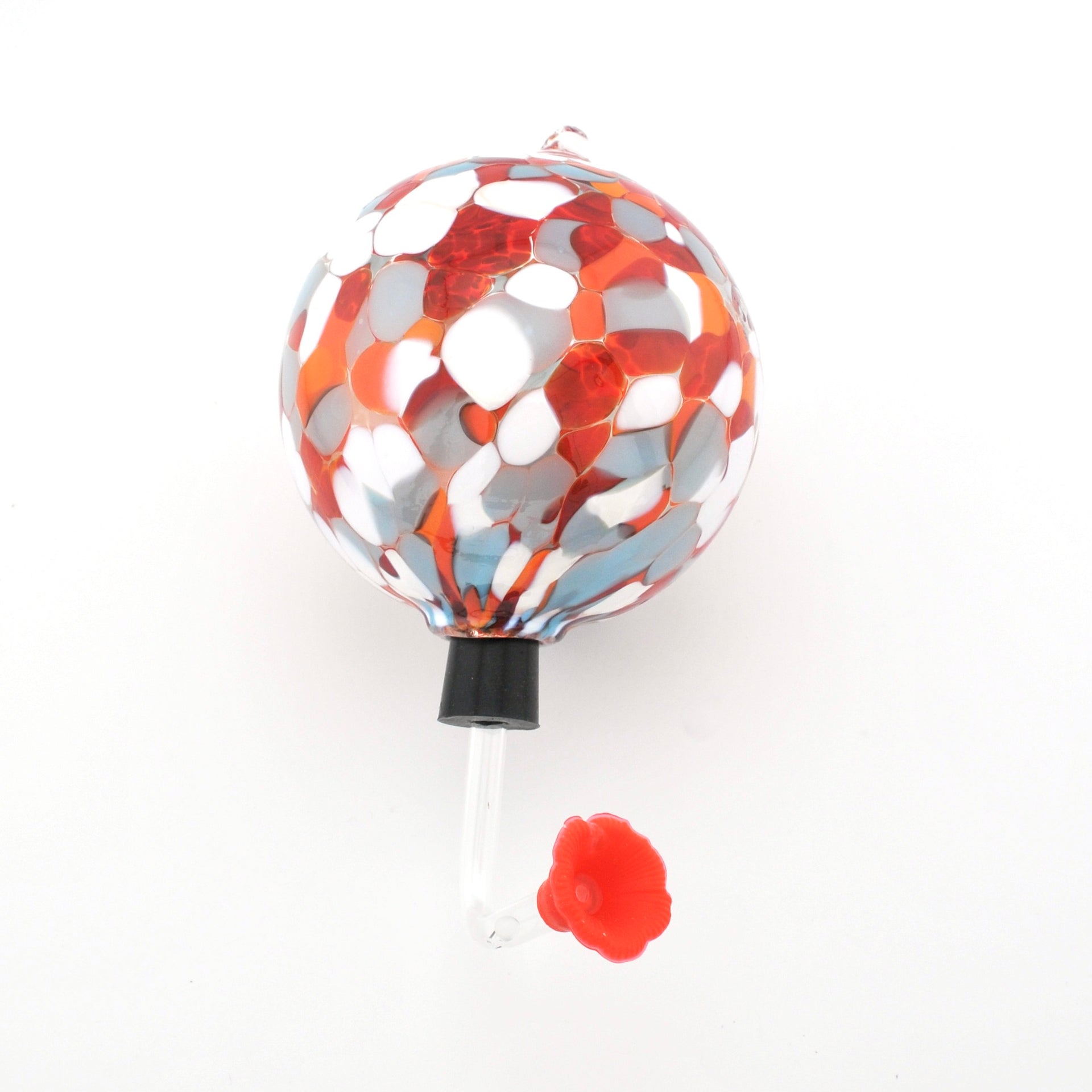 Decorative hummingbird feeder with red and silver design on a white background