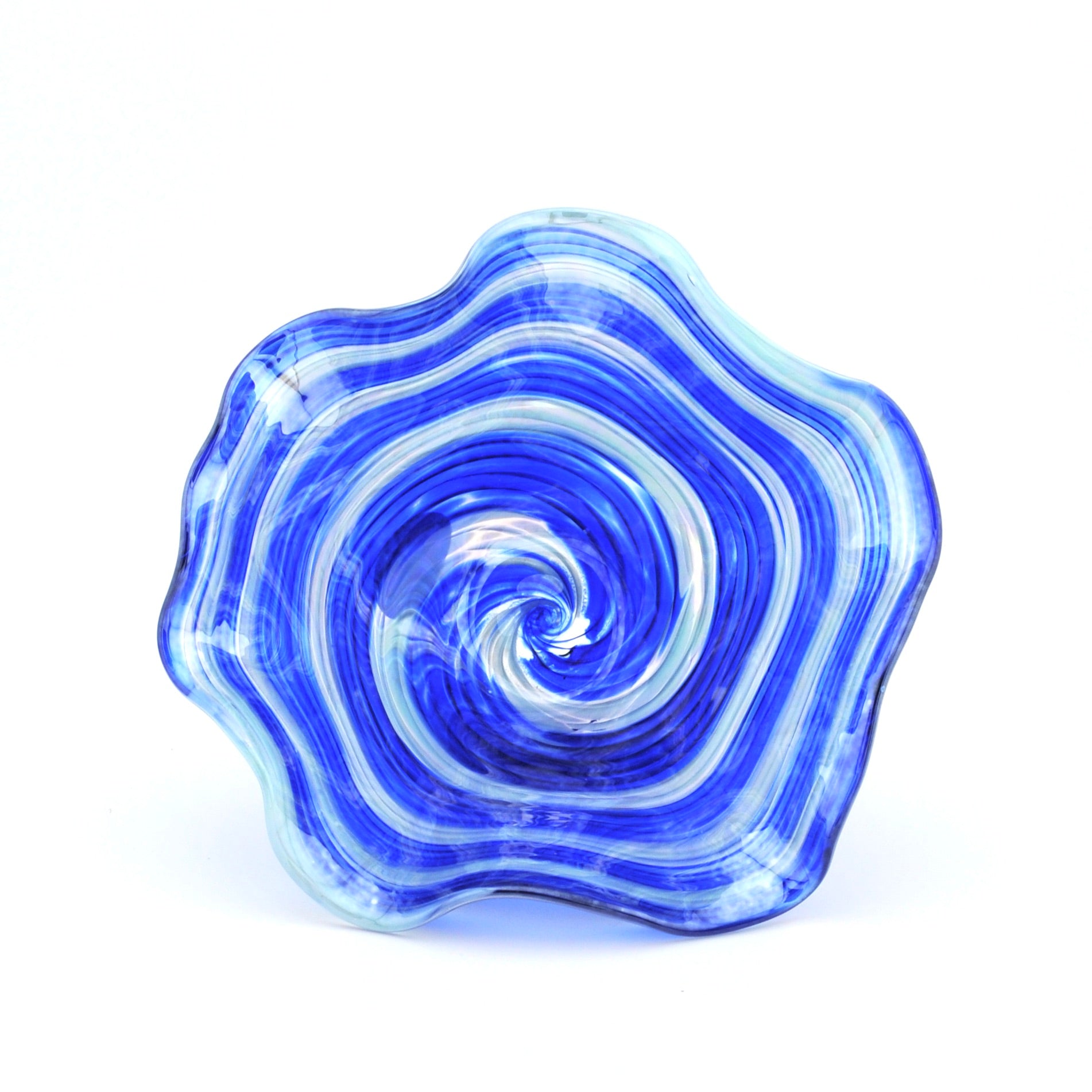 Blue and white glass bowl with swirling pattern on a white background