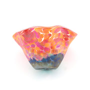 Multicolored glass bowl on a white background