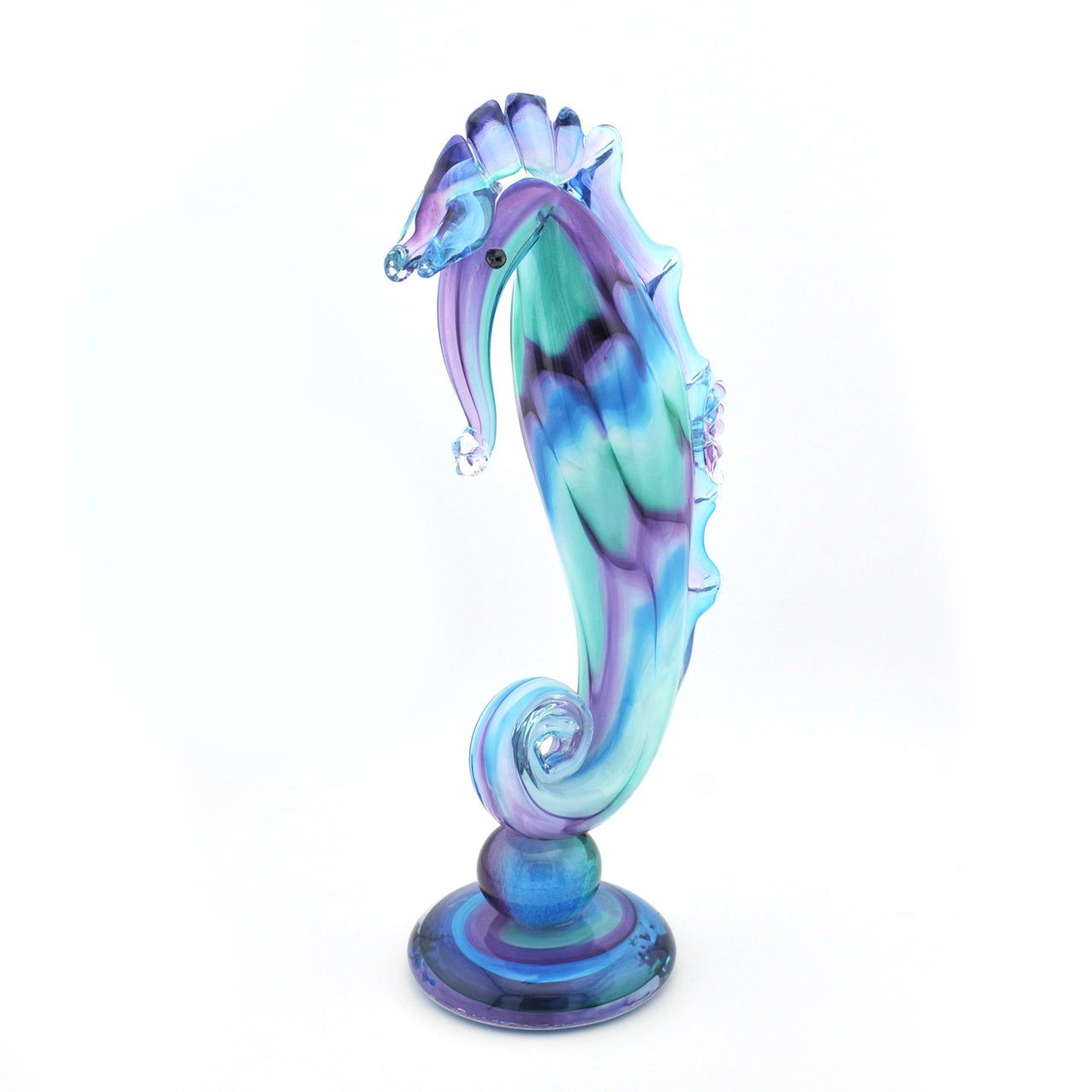 Colorful glass seahorse figurine on a white background