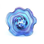 Blue and purple glass sculpture on a white background