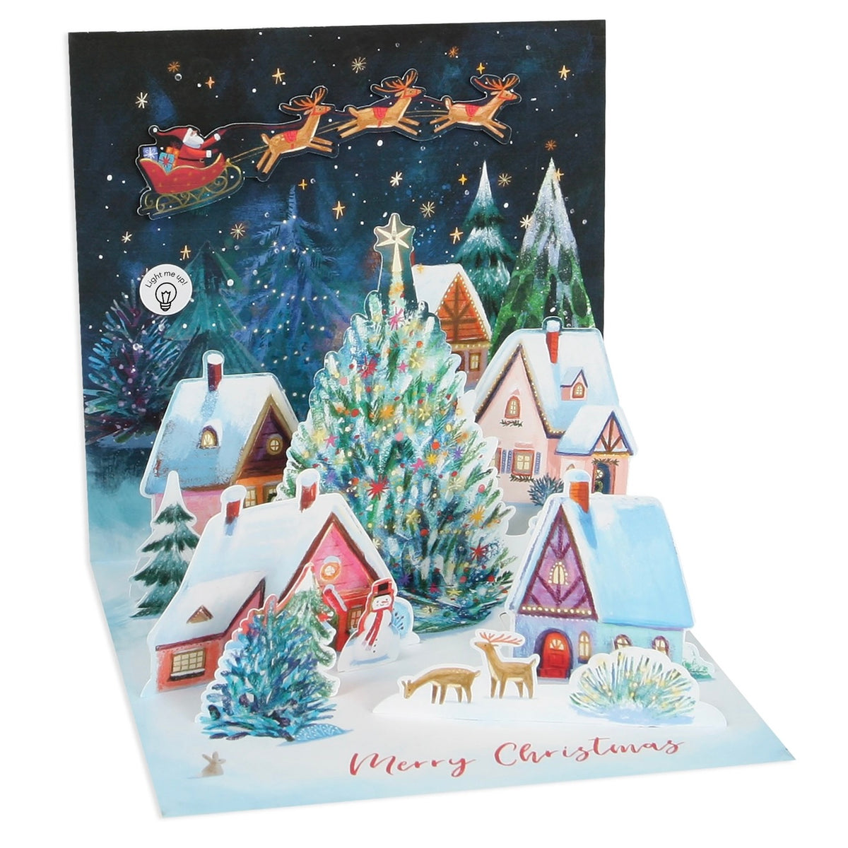 A 3D pop-up Christmas card featuring a snowy village scene with houses, a decorated Christmas tree, reindeer, Santa in his sleigh, and the text 'Merry Christmas' on a white background.