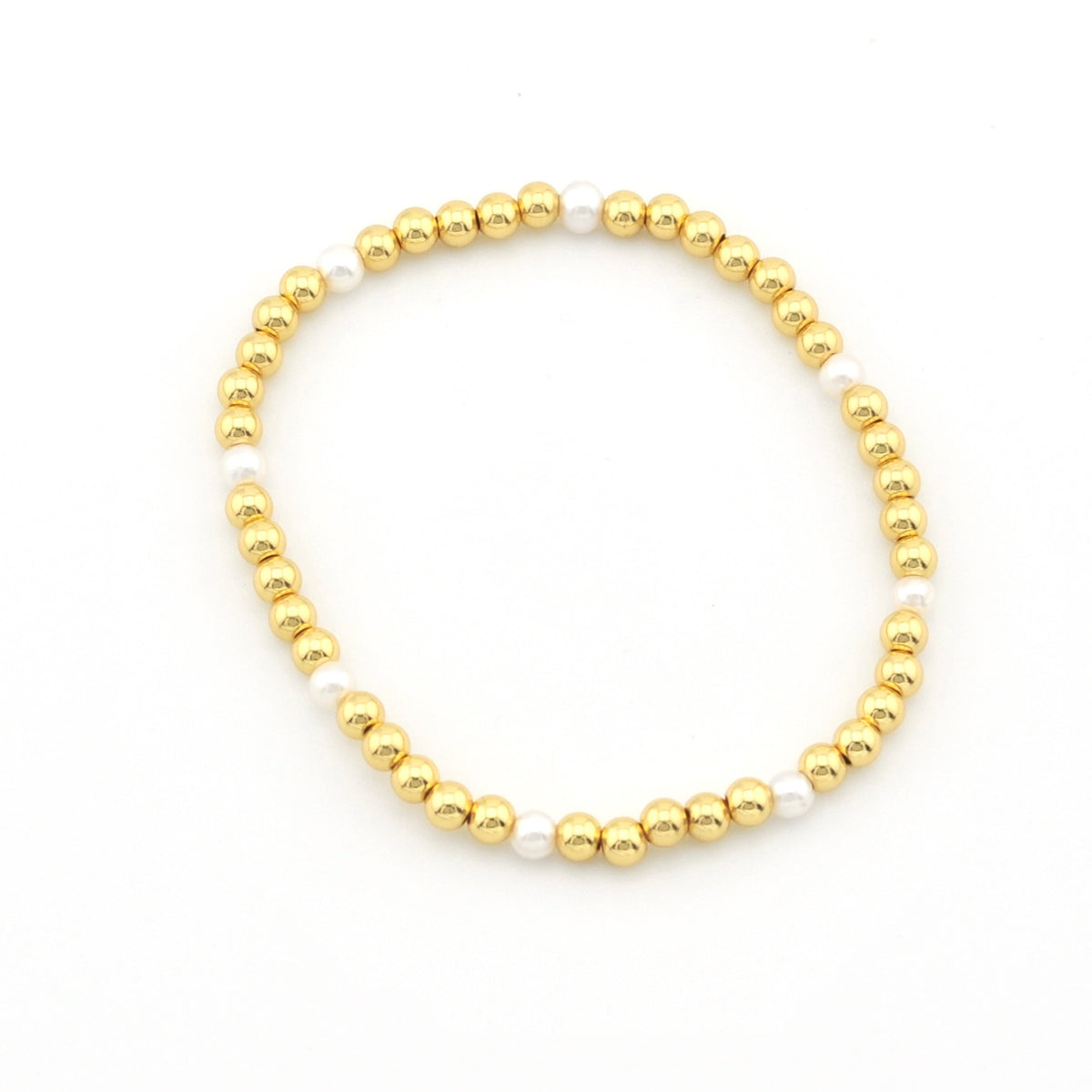 A beaded stretch bracelet featuring alternating shiny gold metallic beads and smooth white pearl-like beads, displayed on a clean white background.